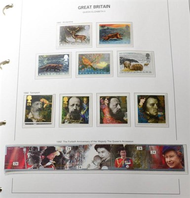 Lot 322 - A collection of GB stamps 1970s-2001 in luxury hingeless Royal Mail albums. Almost complete...