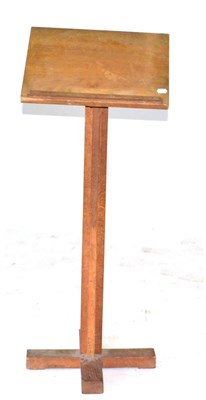 Lot 675 - An Acorn Industries Oak Lectern, on a quatrefoil column and base, with a recessed carved acorn...