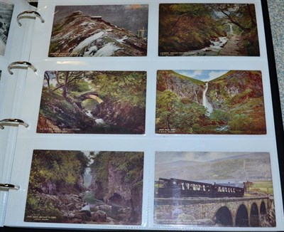 Lot 548 - Railway Postcards - in a fine large album with Views, stations, engines. Mainly fine and...