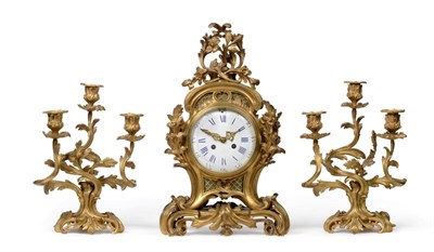 Lot 734 - An Ormolu Bronze Striking Mantel Clock with Garniture, circa 1880, elaborate case with scroll...