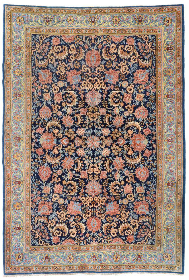 Lot 765 - Ghom Carpet Central Iran, circa 1950 The indigo field with an allover design of large...