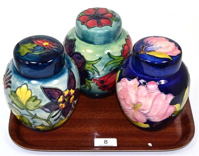 Lot 8 - Three Moorcroft pottery ginger jars and covers, Columbine, Anemone and Magnolia, each 15cm high