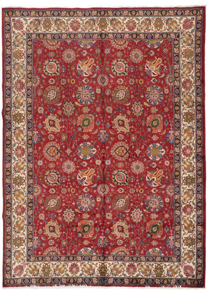 Lot 773 - Tabriz Carpet Iranian Azerbaijan, circa 1950 The raspberry field of Shah Abbas design enclosed...