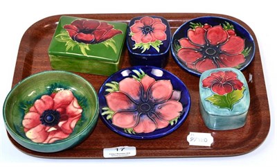 Lot 17 - Moorcroft pottery including two lidded boxes, two coasters and a small bowl, all Anemone...