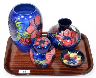 Lot 18 - Moorcroft pottery including two vases and a ginger jar and cover, all in the Anemone pattern;...