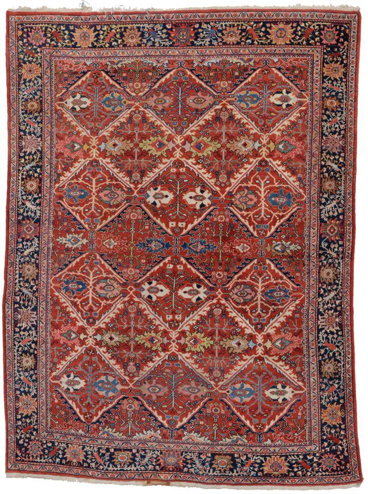 Lot 799 - Sultanabad Carpet West Iran, circa 1920 The tomato red field of diamond lattice design...