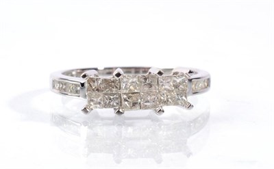 Lot 67 - A 9 carat white gold princess cut diamond triple cluster ring, three sets of four princess cut...