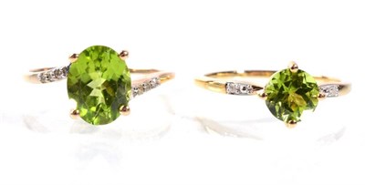 Lot 80 - Two 9 carat gold peridot rings, with diamond set shoulders, finger size R1/2, 5.0g gross (2)