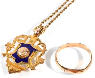 Lot 84 - A 9 carat gold and enamel football pendant and a ring