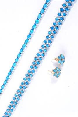 Lot 100 - A silver oval cut neon blue apatite line necklace, length 44cm; a silver pear cut neon blue apatite