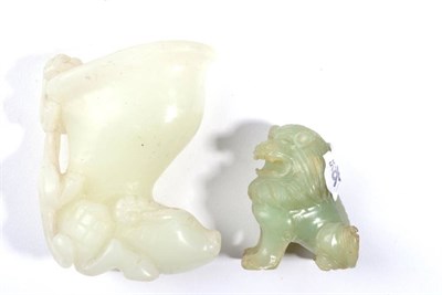 Lot 101 - A 20th century Chinese carved jade libation cup and a smaller jade carving (2)