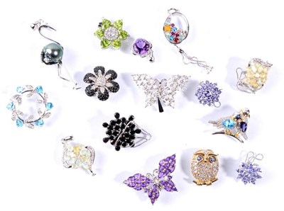 Lot 104 - Various silver gem set pendants and brooches, including a tanzanite owl pendant and a peridot...