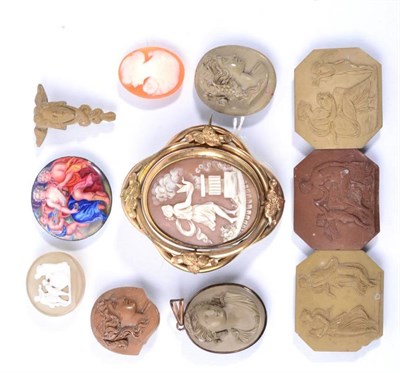 Lot 115 - A collection of lava cameos, including a carving of a head with a Caduceus, three canted oblong...