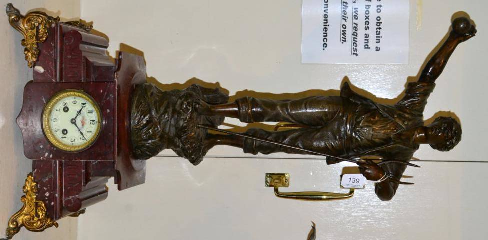 Lot 139 - A French spelter and rouge marble figural mantel clock striking on a bell