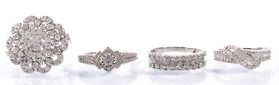 Lot 159 - A large silver diamond set cluster ring, finger size R1/2 and three other silver diamond set...