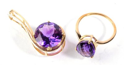 Lot 186 - A 9 carat gold amethyst ring finger size P and a 9 carat gold amethyst pendant, 7.2g gross (2)