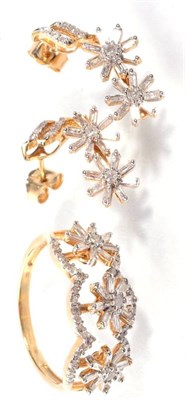 Lot 187 - A 9 carat gold articulated diamond floral ring of three rotating baguette cut diamond clusters...