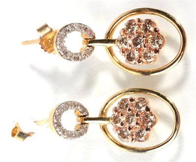 Lot 188 - A pair of 9 carat gold champagne colour diamond cluster earrings, an oval diamond set hoop suspends