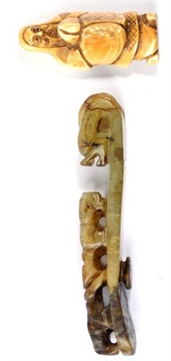 Lot 195 - A 19th century jade type Chinese belt buckle and an early 20th century ivory netsuke