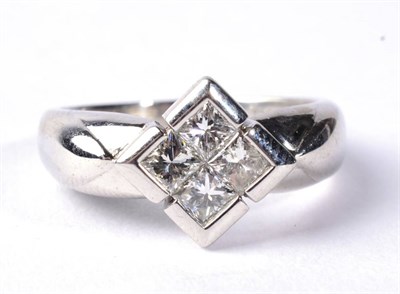 Lot 279 - A princess cut diamond ring, four princess cut diamonds tension set in a kite-shaped frame, to...