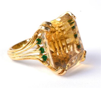 Lot 293 - A citrine and emerald dress ring, an octagonal cut citrine in a double claw setting, to...