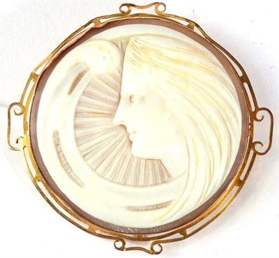 Lot 315 - An Art Nouveau shell cameo brooch, depicting a stylised female bust, within a scroll frame,...