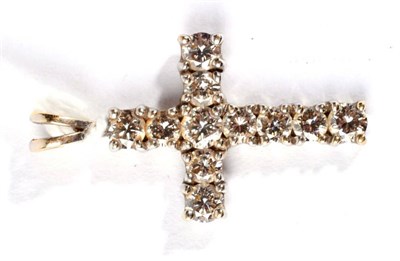 Lot 319 - An 18 carat gold diamond cross pendant, total estimated diamond weight 1.45 carat...