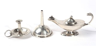 Lot 324 - A silver miniature chamber stick; cigar lighter; and a perfume funnel (3)