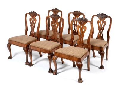 Lot 949 - A Set of Six George I Style Irish Walnut Dining Chairs, with carved top rails above pierced...