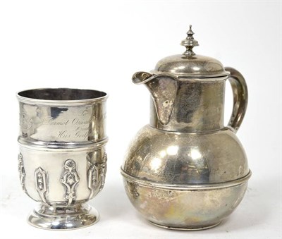 Lot 338 - A silver hot water jug; and a christening mug (2)