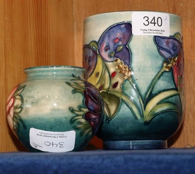 Lot 340 - A Walter Moorcroft pottery Wild Arum pattern vase together with a Moorcroft pottery Anemone pattern