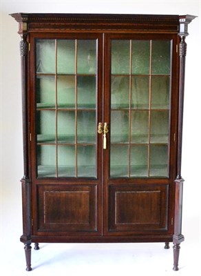 Lot 960 - A Good Quality Edwardian Carved Mahogany Display Cabinet, early 20th century, with a dentil cornice