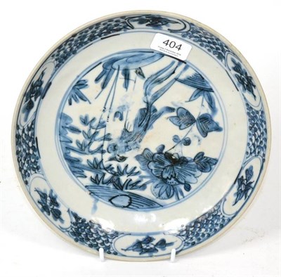 Lot 404 - A Swatow porcelain saucer dish, probably 17th century, painted in underglaze blue with a...