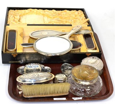 Lot 406 - A part silver mounted tortoiseshell dressing table set, Birmingham 1927, in a fitted case...