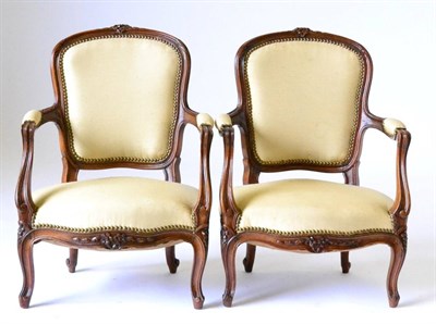 Lot 974 - A Pair of French Louis XV Style Beech Framed Child's Bergères, late 19th century, upholstered in