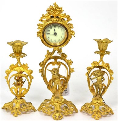 Lot 419 - A French gilt-metal boudoir timepiece garniture, early 20th century, Arabic dial, cherub and...