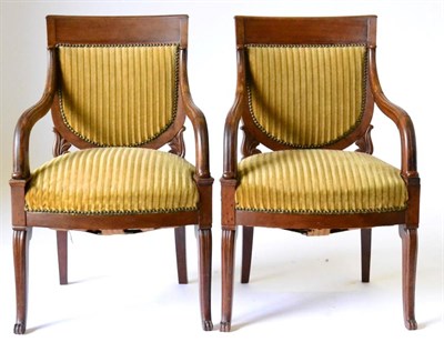 Lot 978 - A Pair of Charles X Mahogany Fauteuils, early 19th century, recovered in close-nailed yellow...