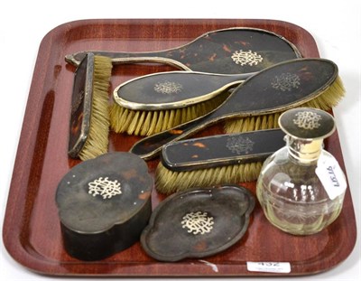 Lot 432 - A silver mounted tortoiseshell dressing table set, Cole Brothers, London 1915/16, with silver inlay