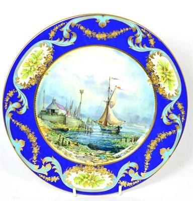 Lot 447 - Stephen Nowacki for Lynton Porcelain, a blue and gilt plate painted with a fishing boat by a...