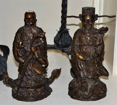 Lot 465 - A pair of Chinese bronze figures of sages