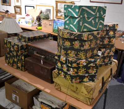 Lot 1162 - Assorted luggage and packaging, including a Revelation cream vellum suitcase, another in brown...