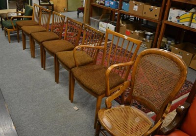 Lot 1220 - A group of seven spindle back chairs comprising five dining chairs and two armchairs