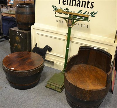 Lot 1221 - A barrel converted to a seat together with a similar table and with a wrought iron bound...