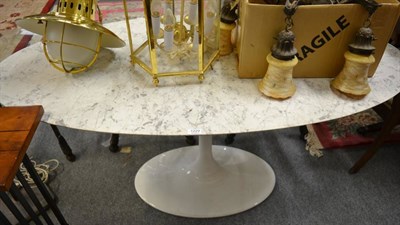 Lot 1229 - An Italian white and grey marble effect oval table, modern, raised on narrow tapering white painted