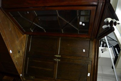 Lot 1245 - A mahogany glazed corner cupboard together with an early 19th century oak corner cupboard (2)