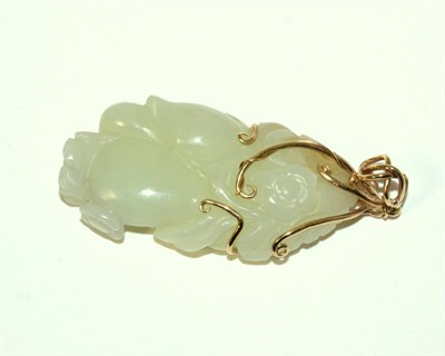 Lot 160 - A Chinese Jade Carving, naturalistically modelled with fruit and flowers, 5.5cm high, mounted...