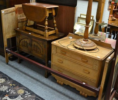 Lot 1265 - A light oak double bed with a matching three height chest of drawers