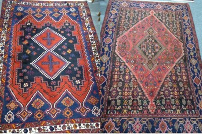 Lot 1279 - Afshar rug, South East Iran, the charcoal field with two hooked medallions enclosed by triple...