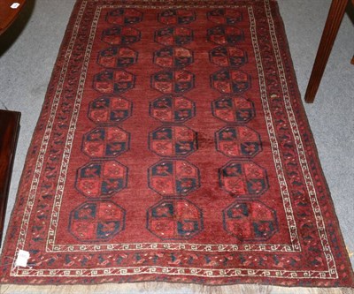 Lot 1287 - Turkmen rug North West Afghanistan, the madder field of ''elephant foot'' guls enclosed by...