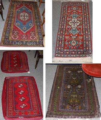 Lot 1289 - A pair of Turkmen chuvals now as cushion covers, North Afghanistan, each with a crimson field...